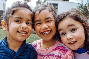 3 young girls smiling